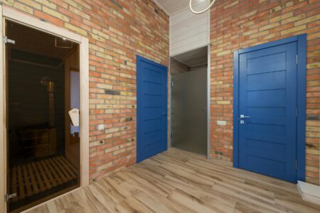 Warm wooden sauna interior with benches and soft lighting, designed for communal use