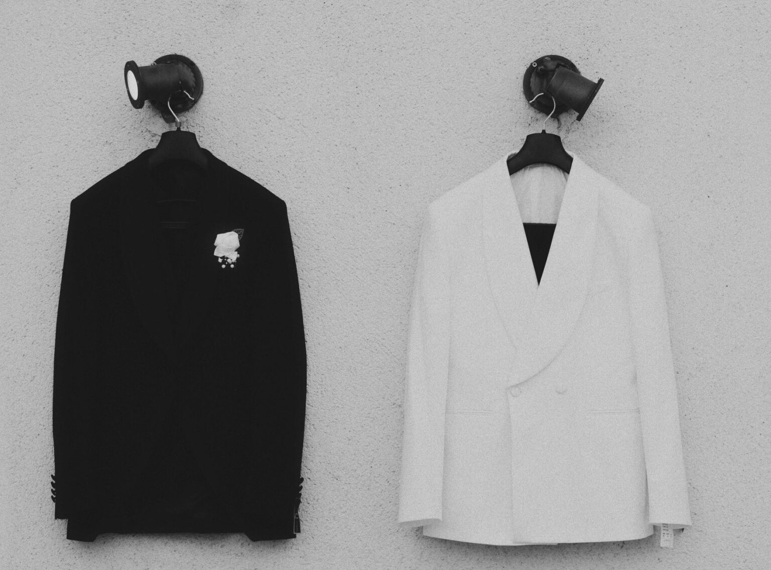 A sharply tailored blazer displayed on a minimalist fashion background