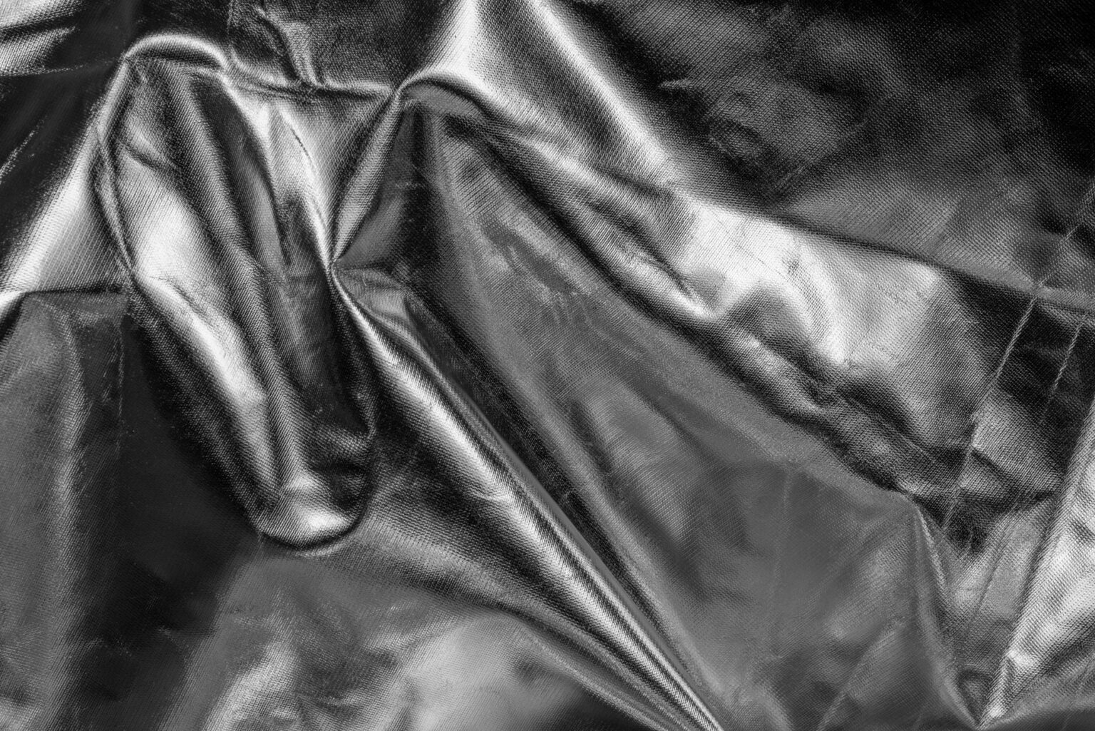 Close-up of finely pleated lightweight fabric in neutral tones
