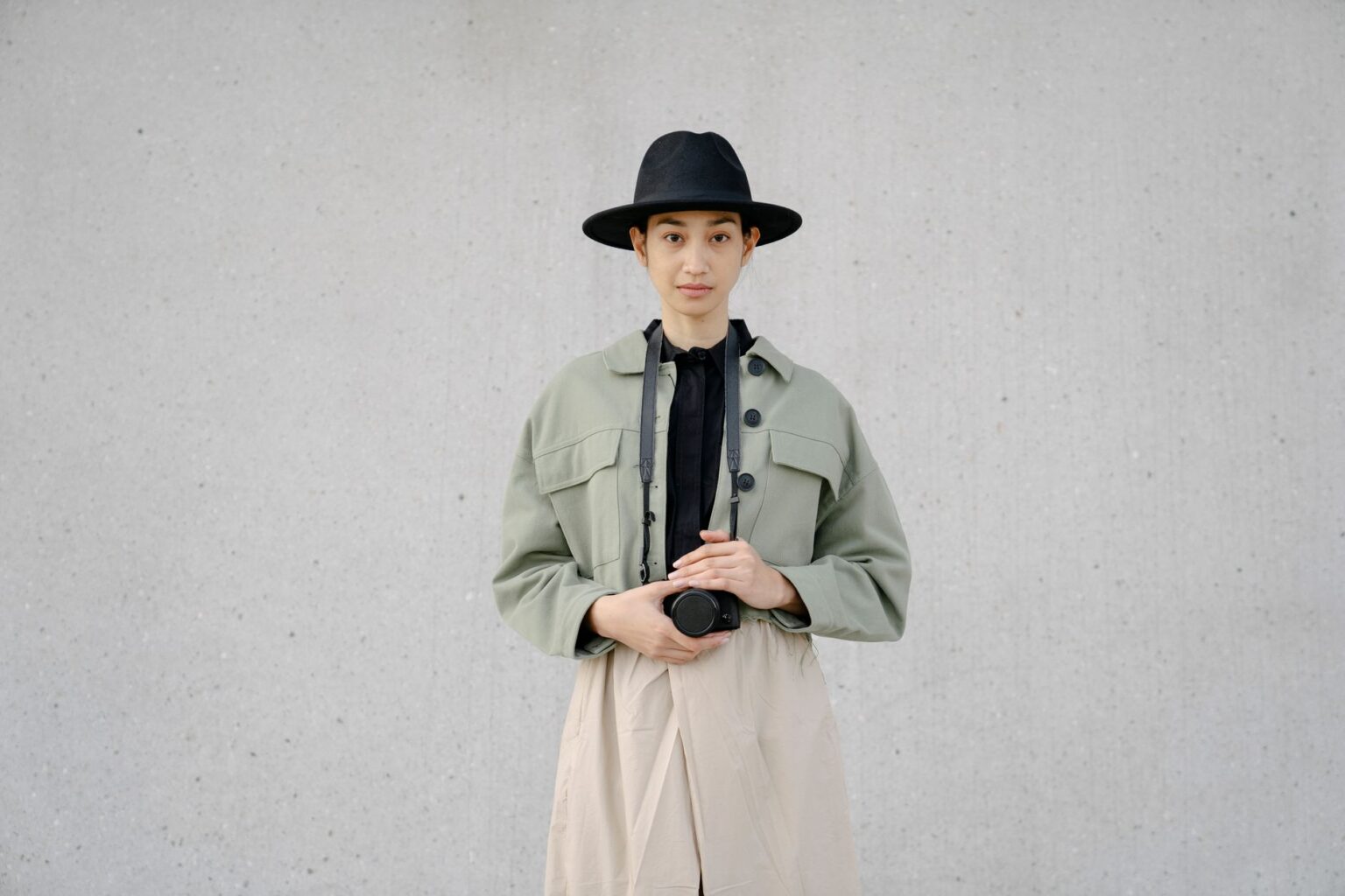 A minimalist luxury outfit laid flat, showing clean tailoring and neutral tones
