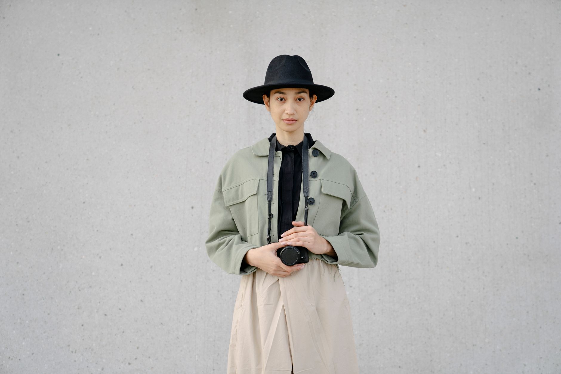 A minimalist luxury outfit laid flat, showing clean tailoring and neutral tones