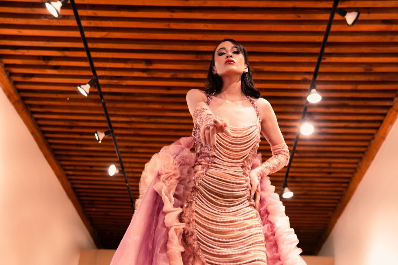 Close-up of a minimalist fashion runway look featuring body-conscious silhouette