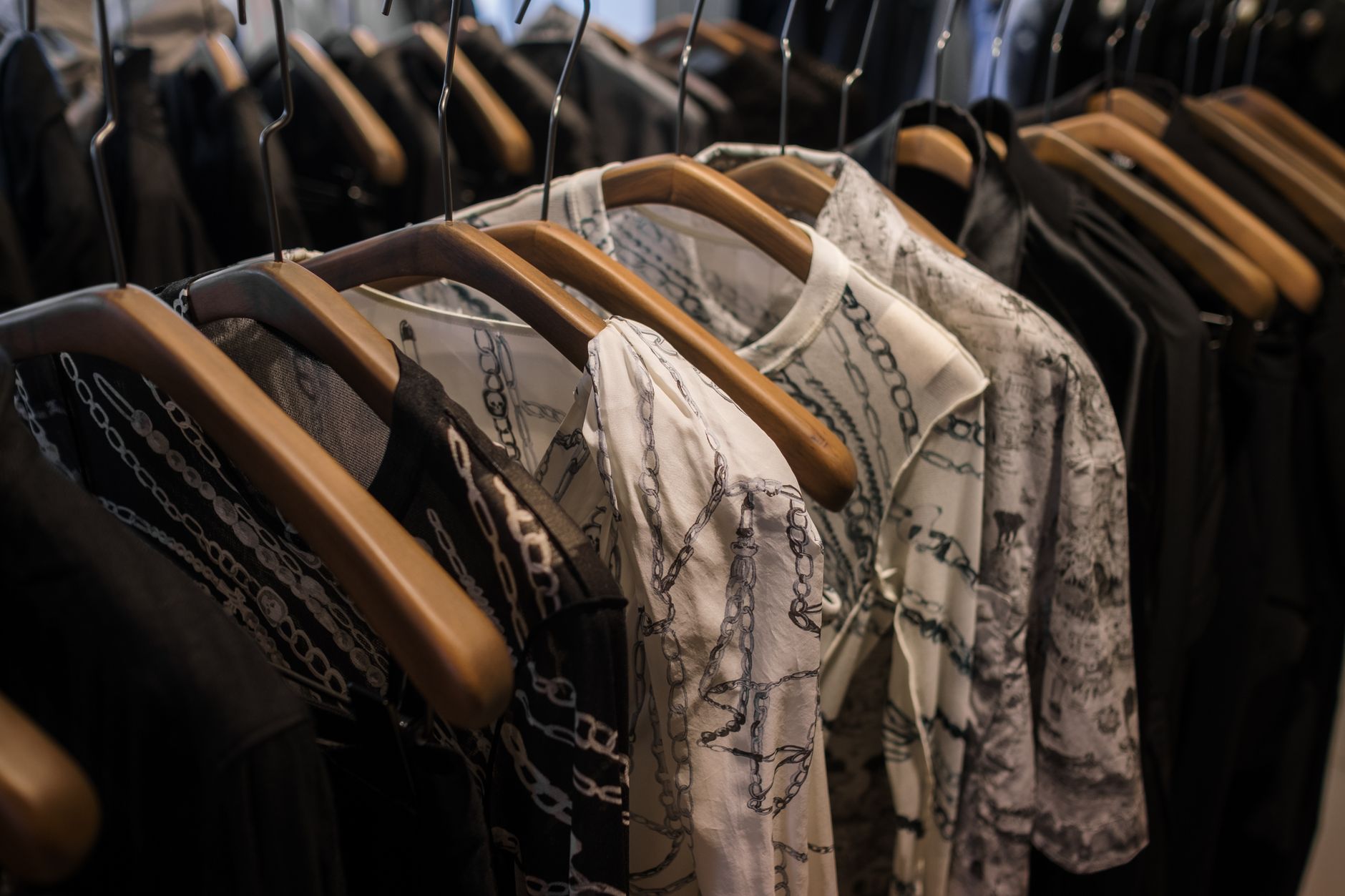 Interior of a high-end secondhand fashion boutique with curated handbags on display