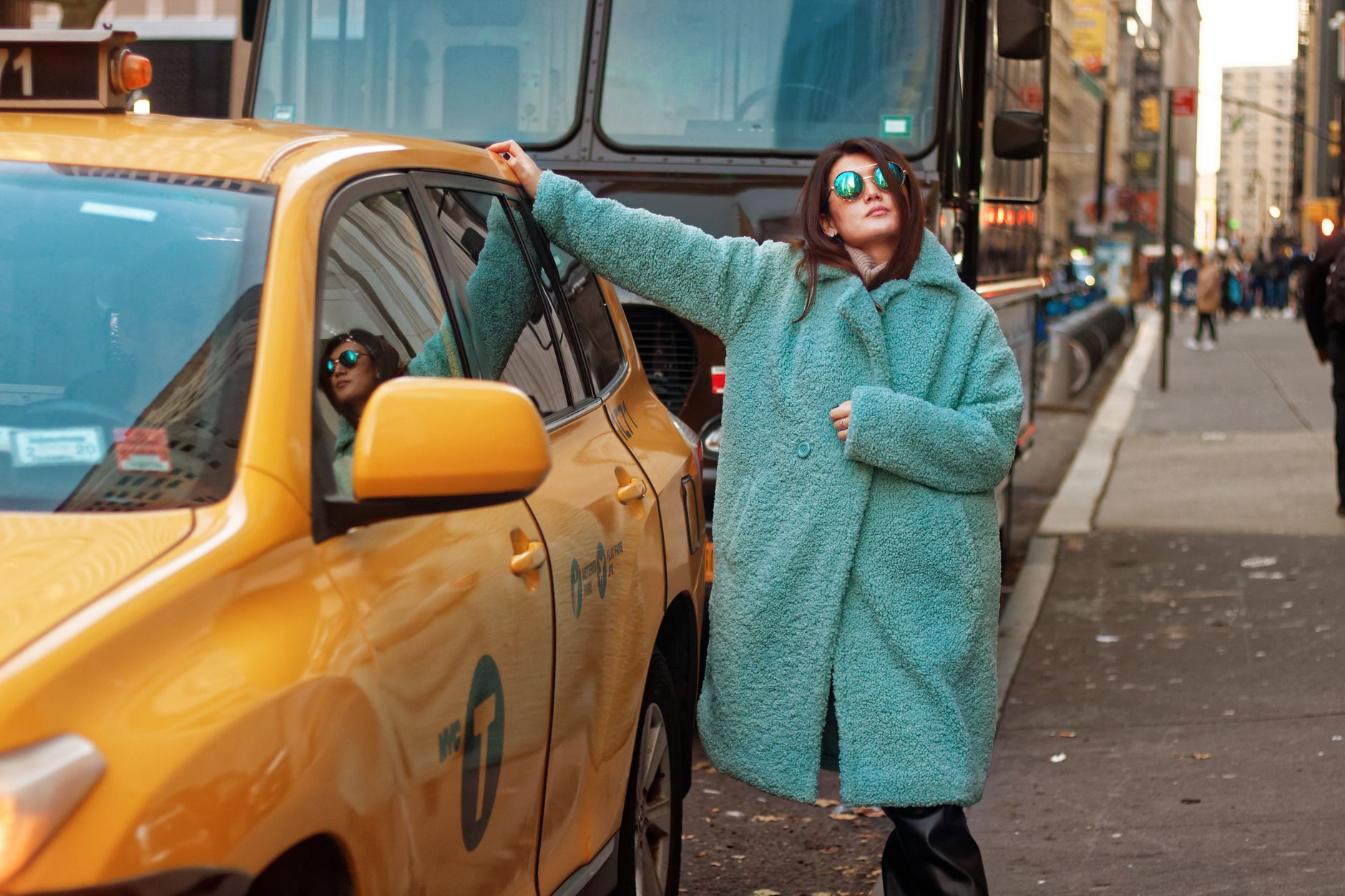 Street style fashion shot featuring structured dark layering and asymmetric silhouettes