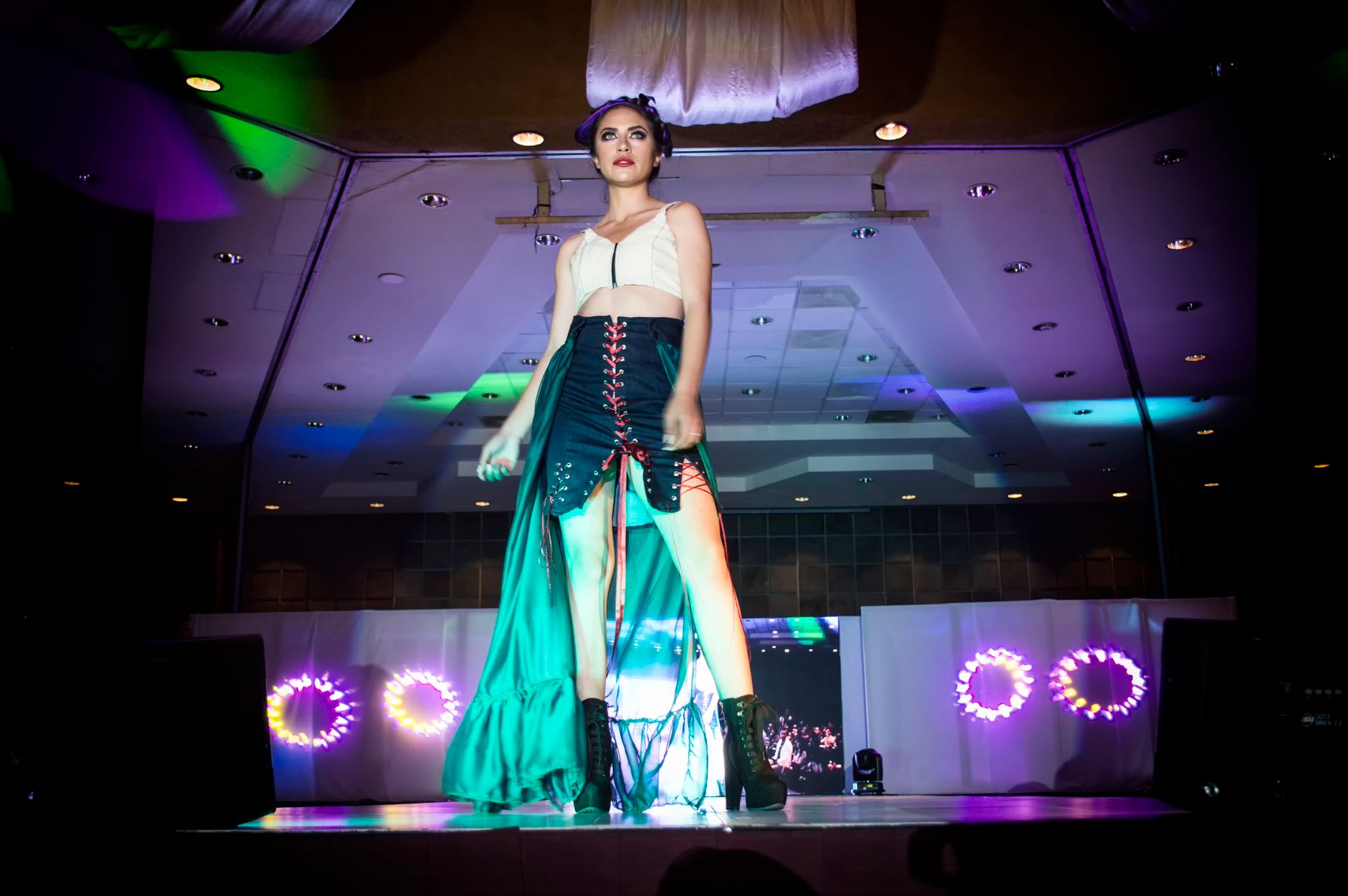 Models walking a contemporary fashion runway during a show
