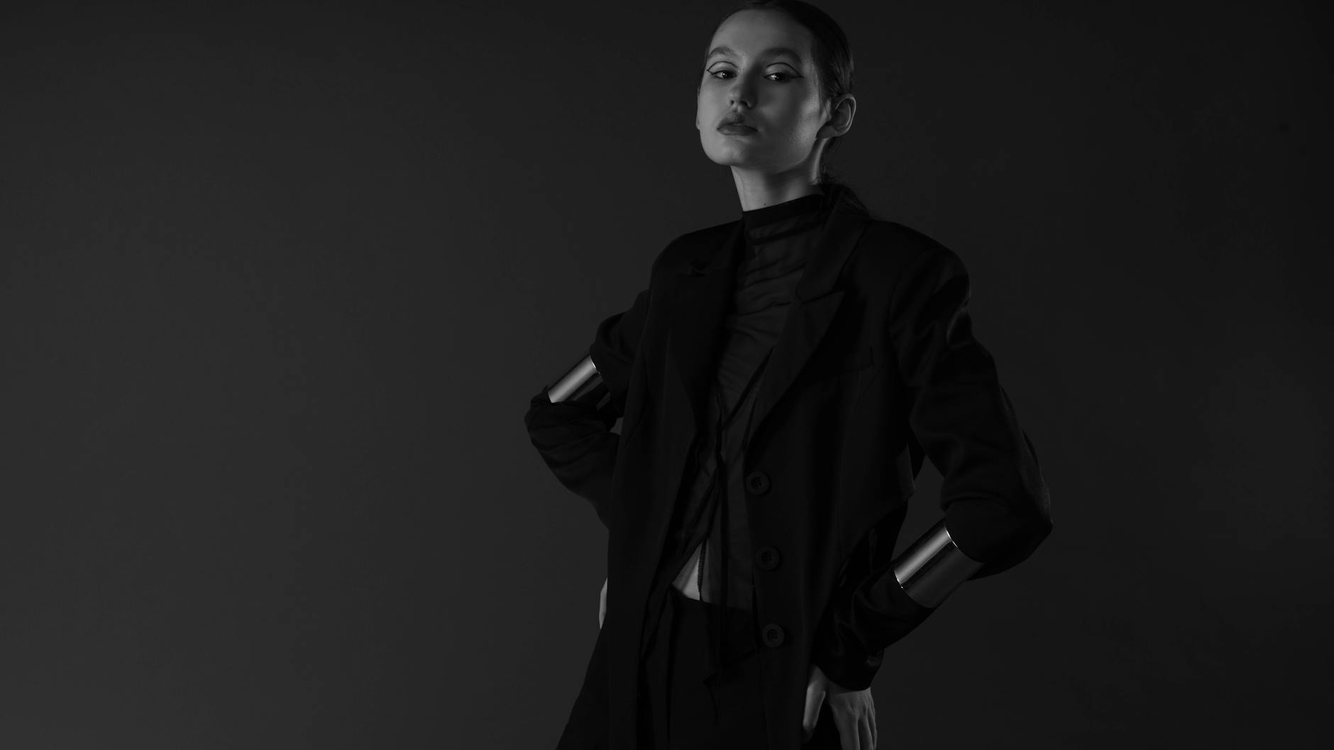 Minimalist fashion editorial photograph featuring structured tailored clothing