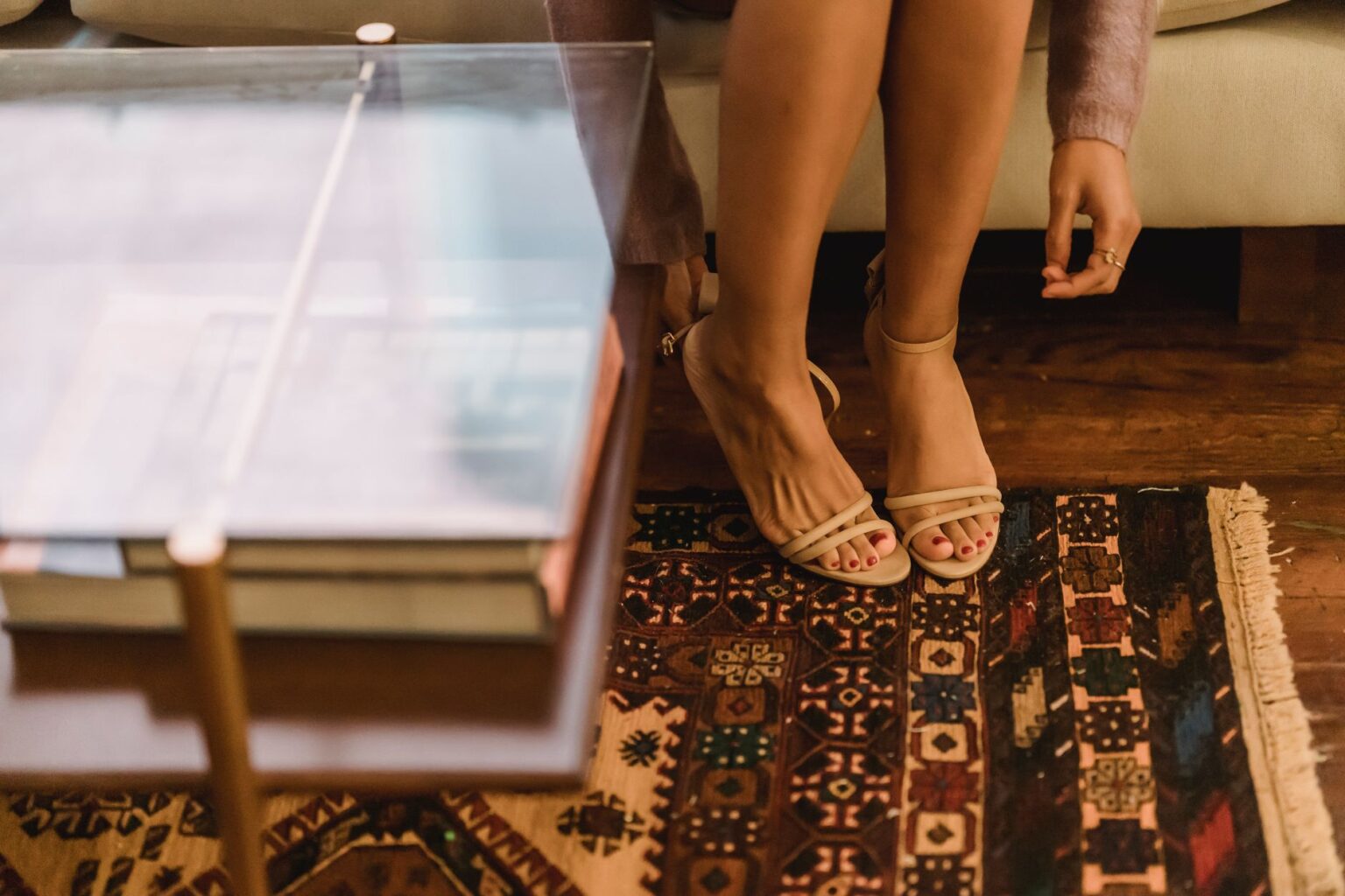 Close-up of a pair of minimalist leather flat sandals on a clean surface
