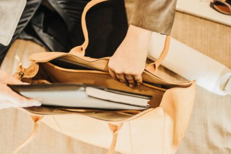 A structured leather tote bag with clean lines and minimal hardware on a neutral background
