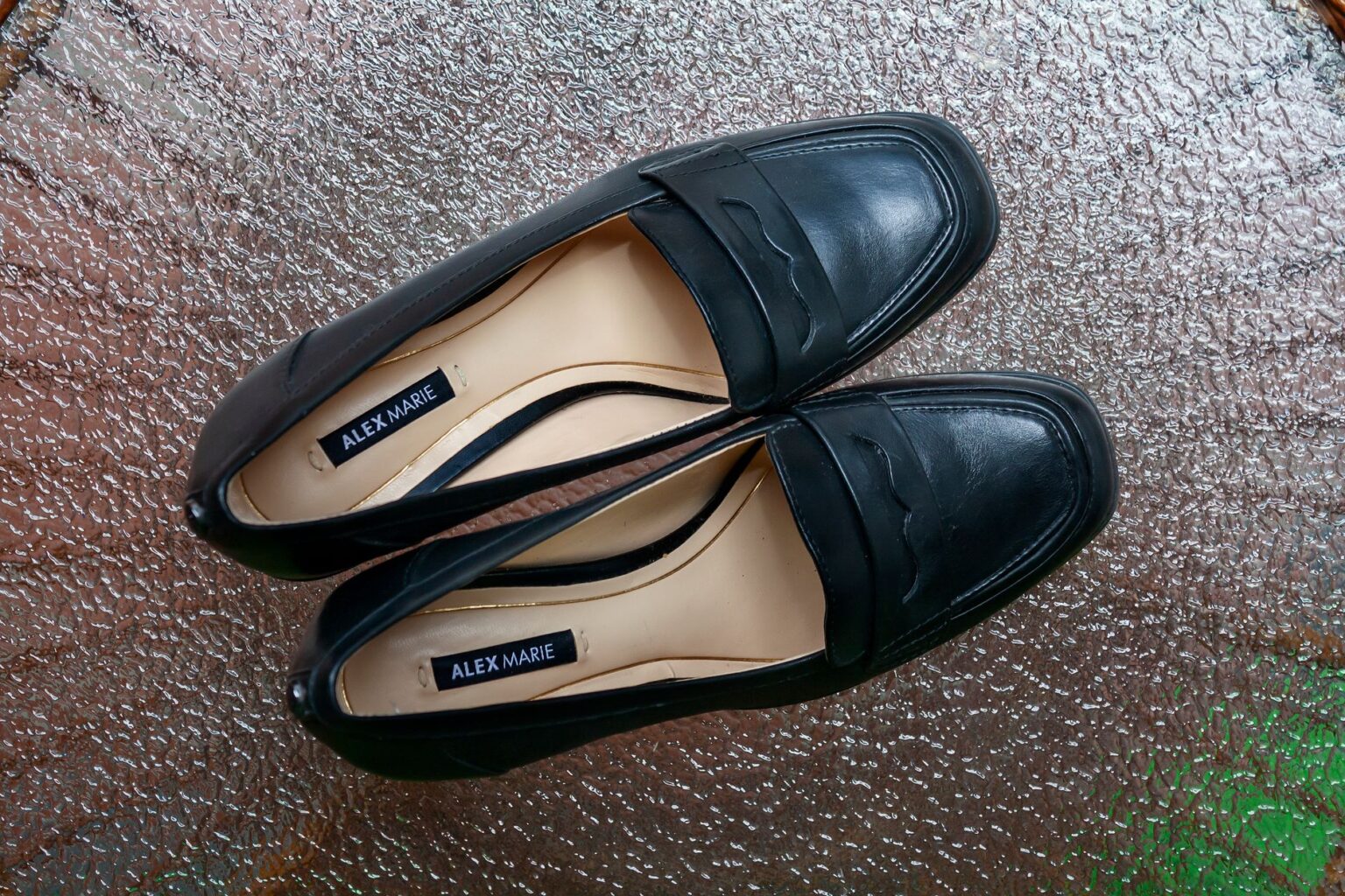 Classic Mary Jane shoes displayed on a clean surface, showing rounded toe and single strap detail
