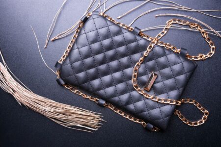 Minimalist luxury handbags displayed on a clean white surface