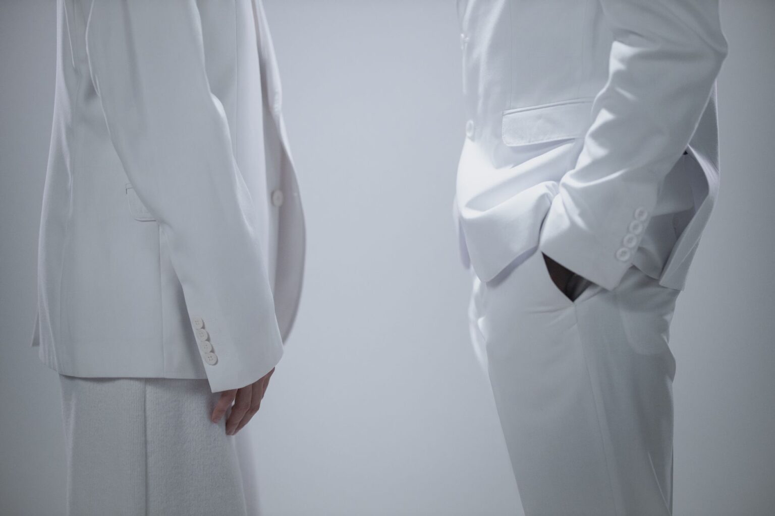 A clean, structured blazer in neutral fabric representing minimalist tailoring
