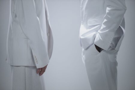 A clean, structured blazer in neutral fabric representing minimalist tailoring