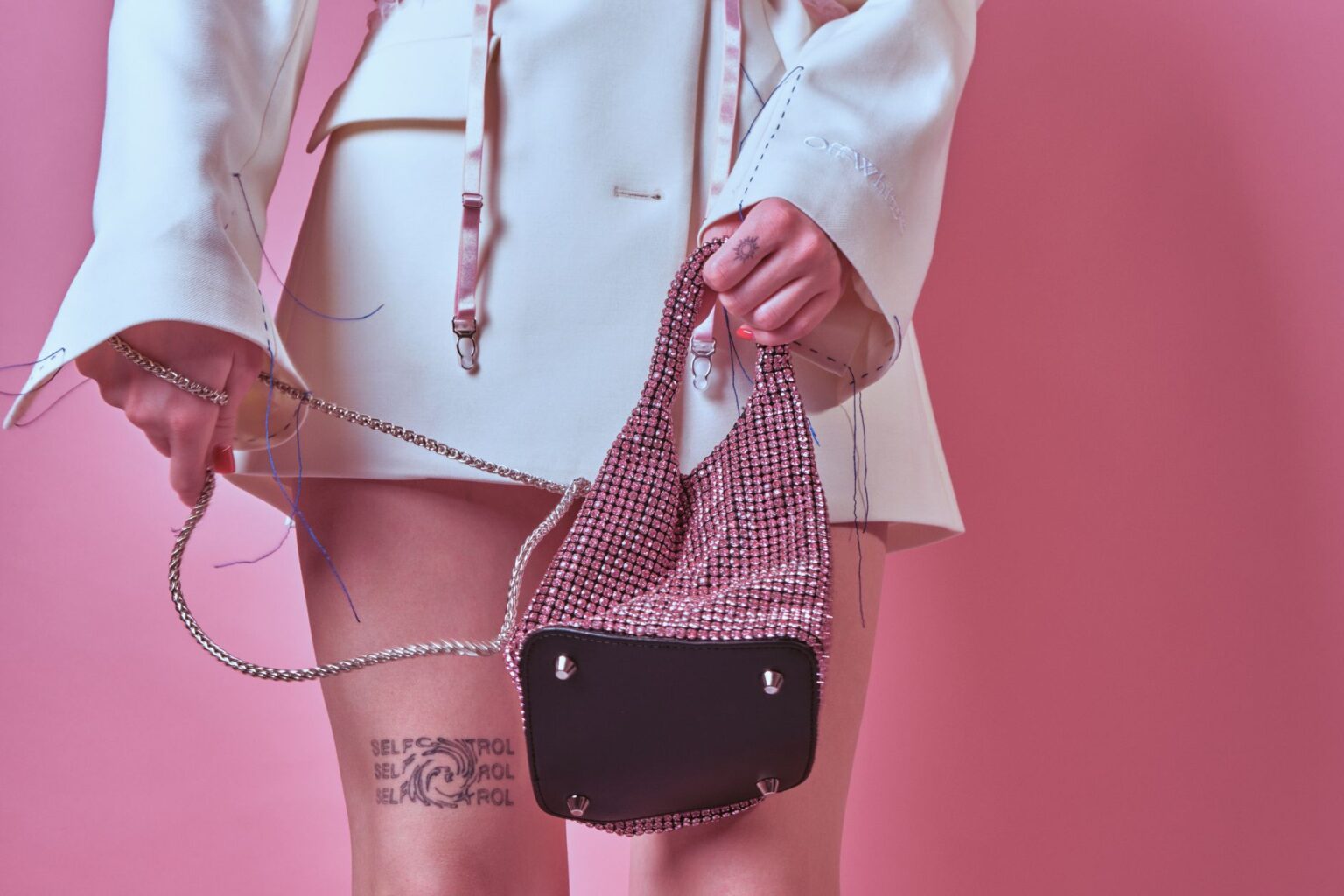 A small structured leather handbag displayed against a neutral background