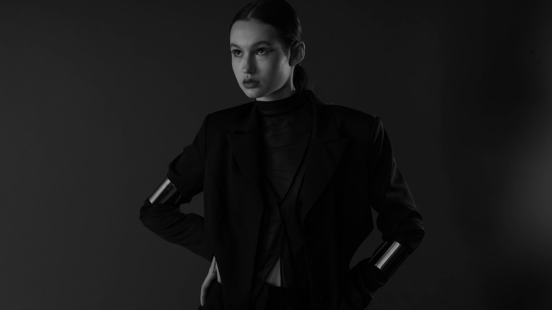 Minimalist fashion editorial styling with a structured handbag