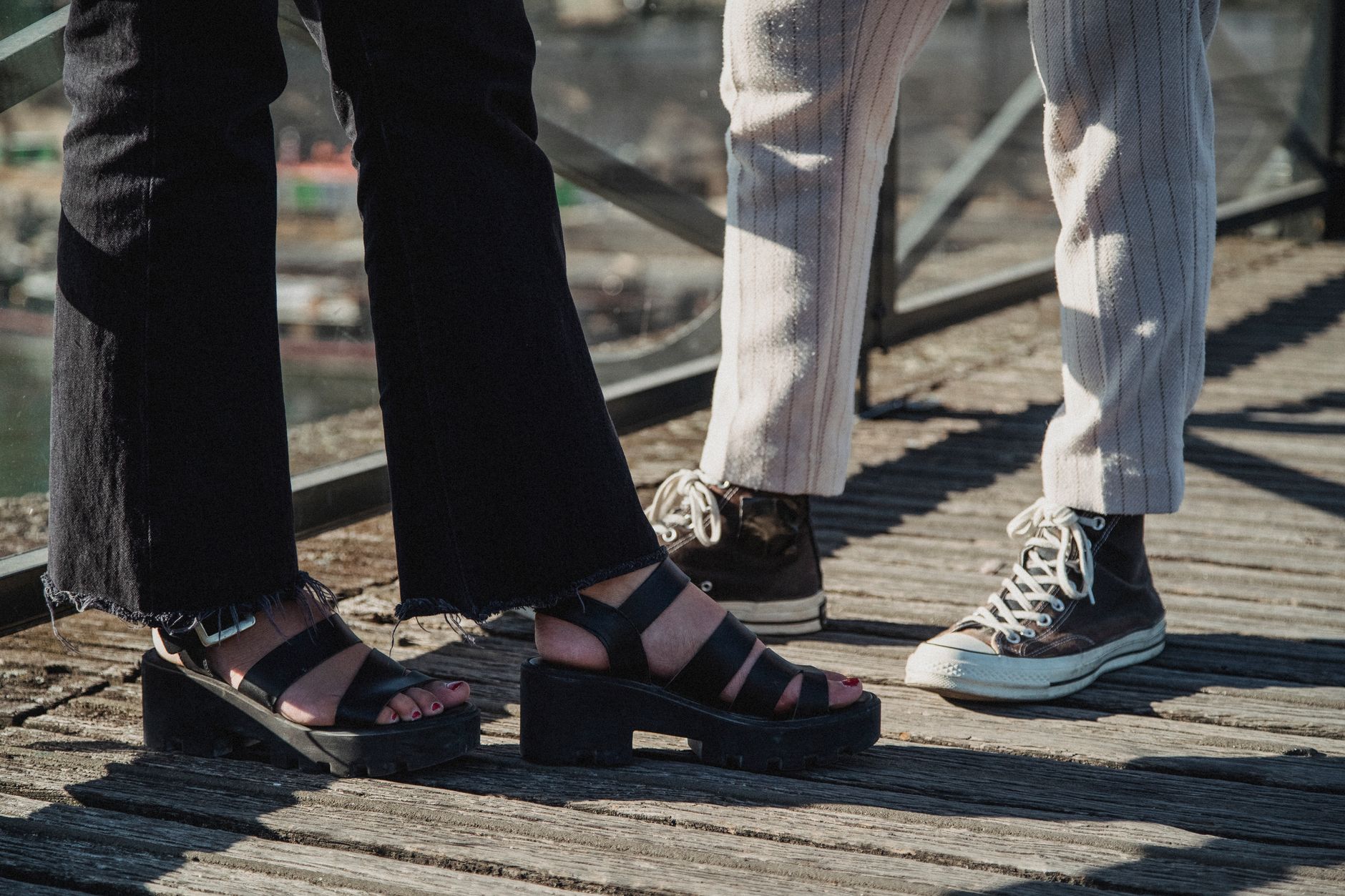 Stylish footwear detail shot on a city sidewalk with tailored trousers