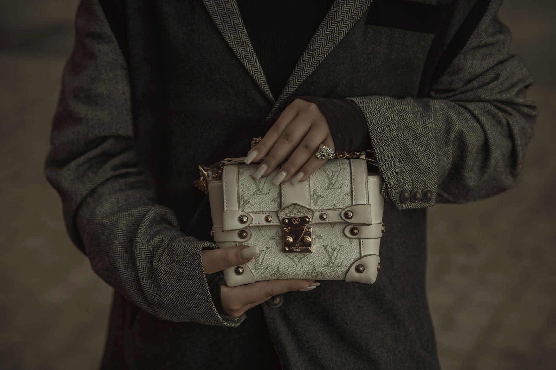 Neatly folded luxury garments displayed in a minimal retail setting