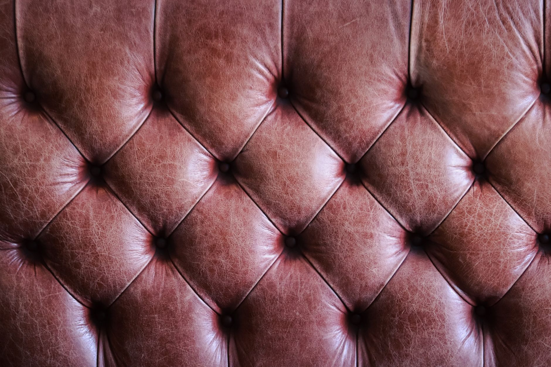 Close-up of interlaced leather weave on a luxury handbag
