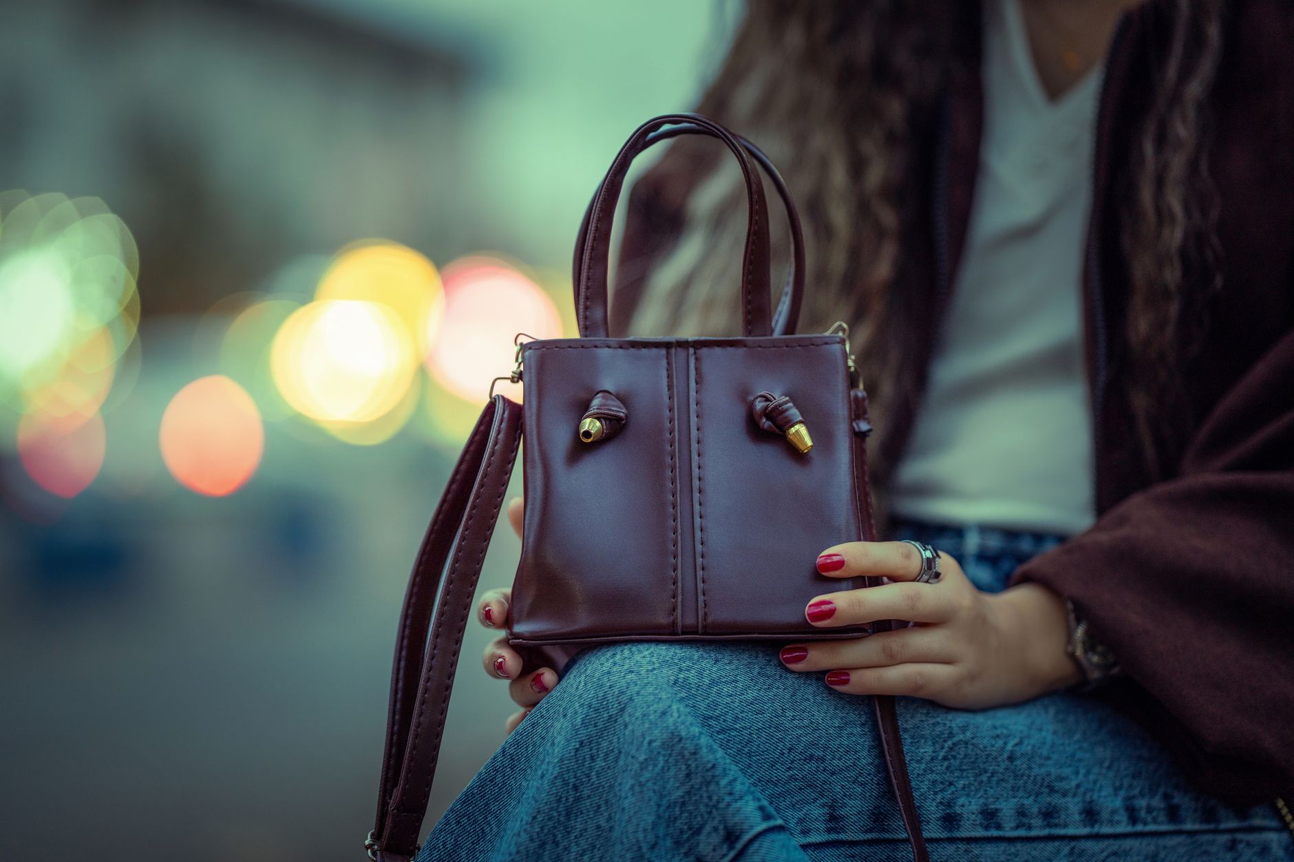 Person carrying a sleek minimalist bag on a city street