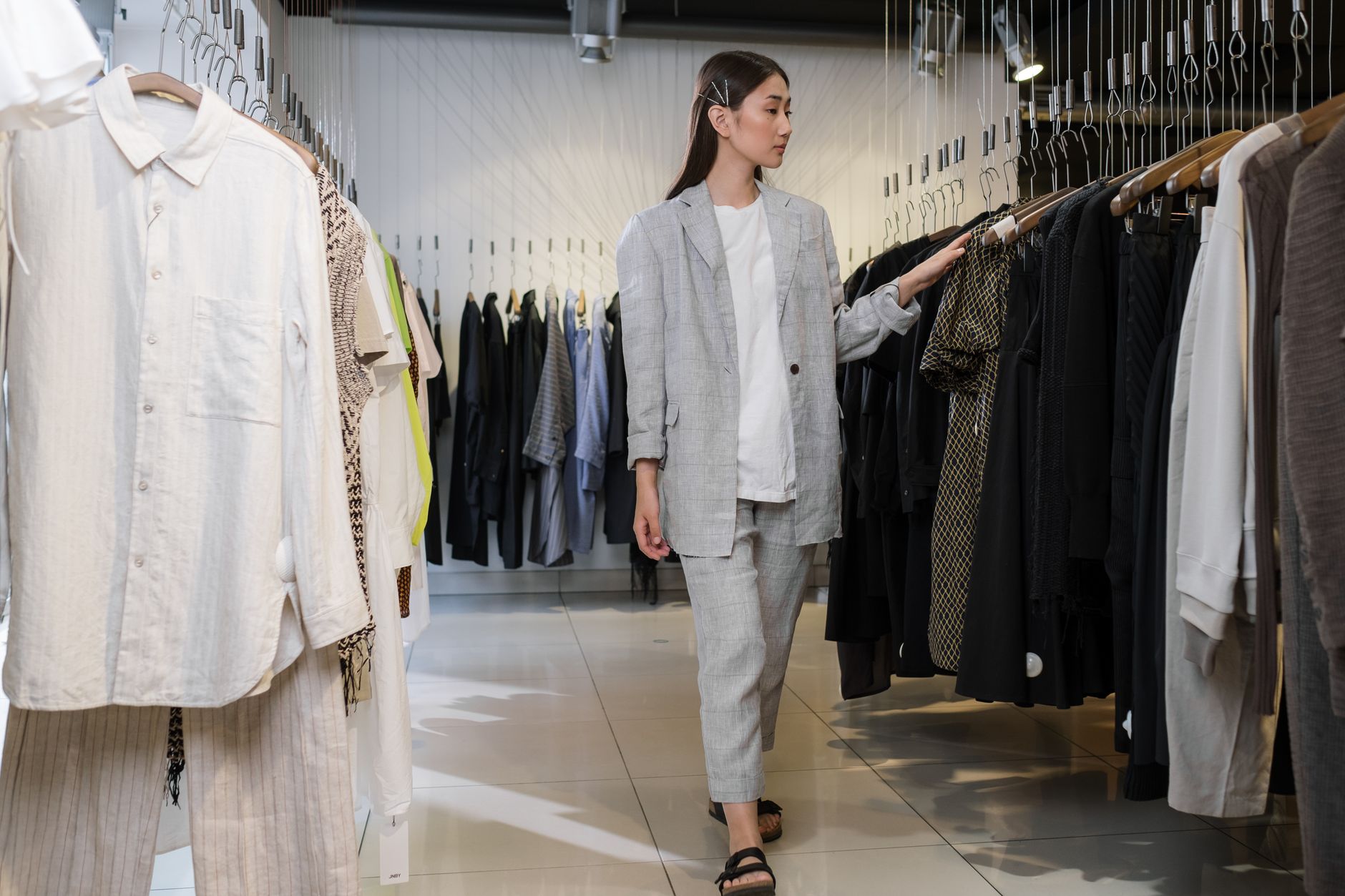 Minimalist luxury retail interior with shoes displayed on shelving