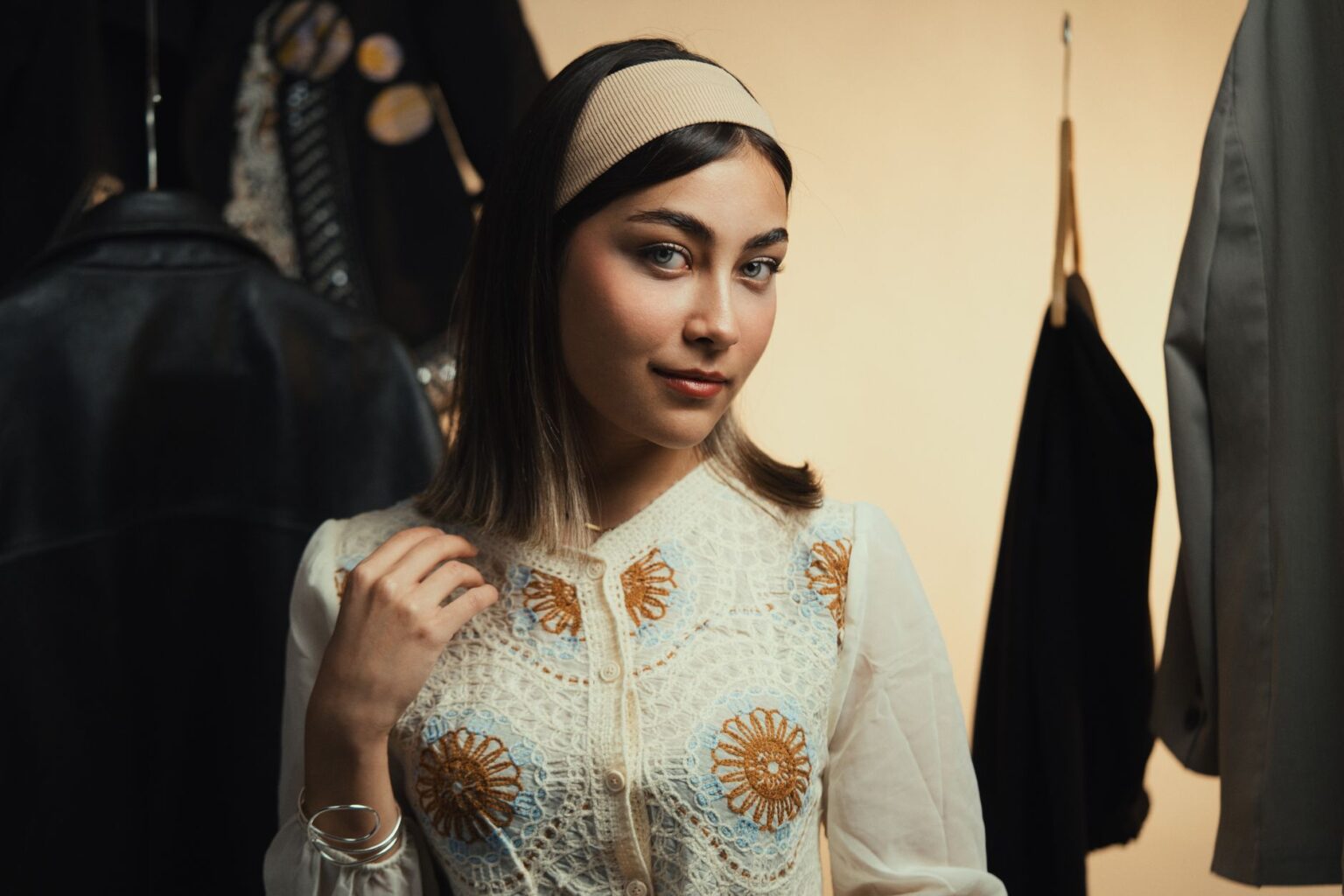A woman wearing a wide padded velvet headband as a fashion accessory