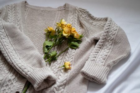 Toteme’s Cashmere Cardigan Is Quietly Edging Out the Knit Blazer A neatly folded soft cashmere cardigan in a neutral tone displayed on a flat surface