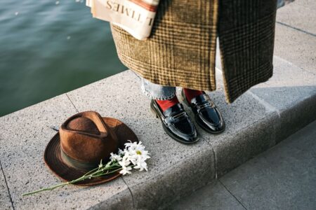 The Padded Loafer Is Quietly Edging Out the Ankle Boot Pair of padded loafers styled with wide-leg trousers on a polished surface