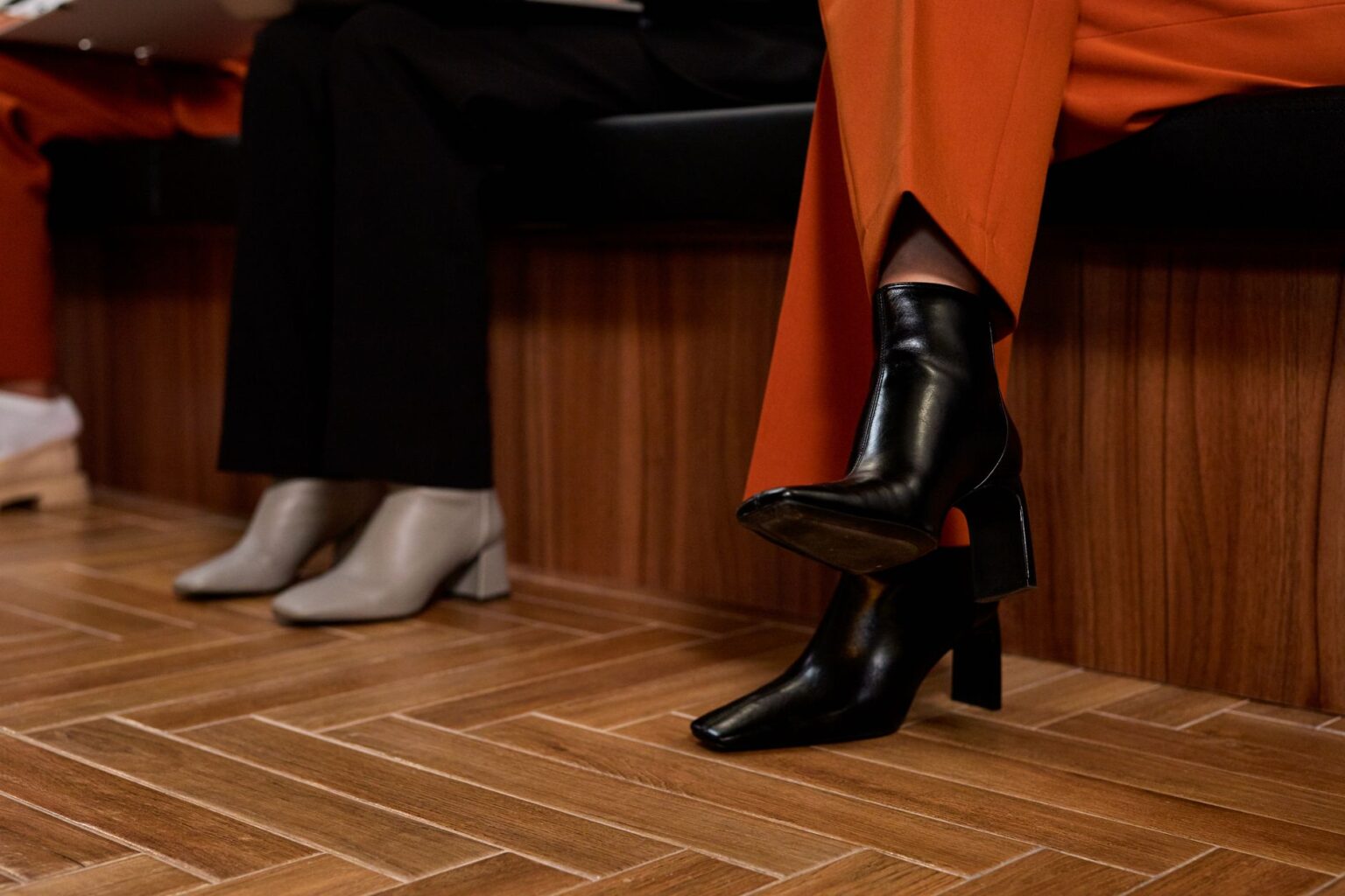 The Kitten Heel Boot Is Quietly Edging Out the Ankle Boot A pair of pointed-toe kitten heel boots styled with tailored trousers