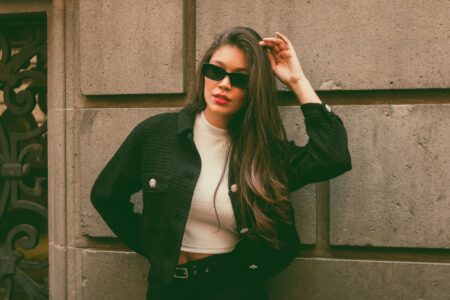 Woman wearing a tailored tweed jacket styled with modern casual clothing