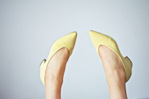 The Pointed-Toe Mule Is Quietly Edging Out the Strappy Kitten Heel A pair of sleek pointed-toe mules in neutral leather on a minimalist background