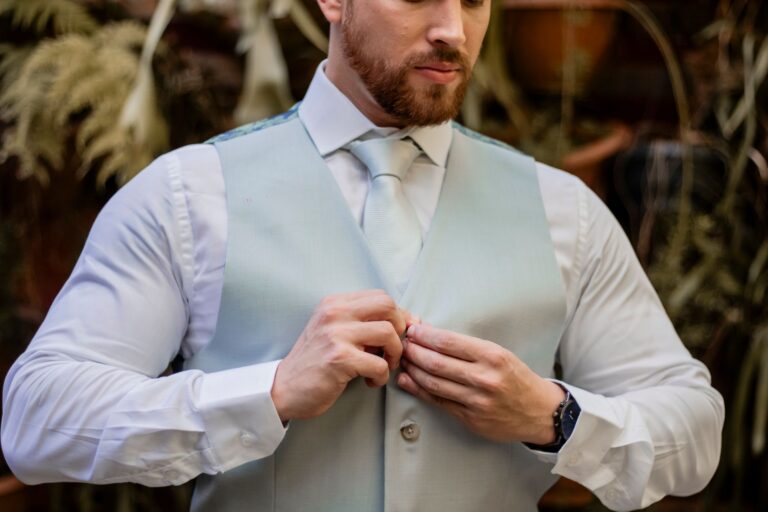 The Broderie Anglaise Waistcoat Is Quietly Edging Out the Tailored Vest A white broderie anglaise waistcoat laid flat, showing delicate eyelet embroidery detail
